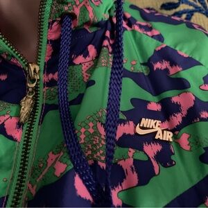 Vintage Nike animal print track jacket. Vibrant colors and collectible details.